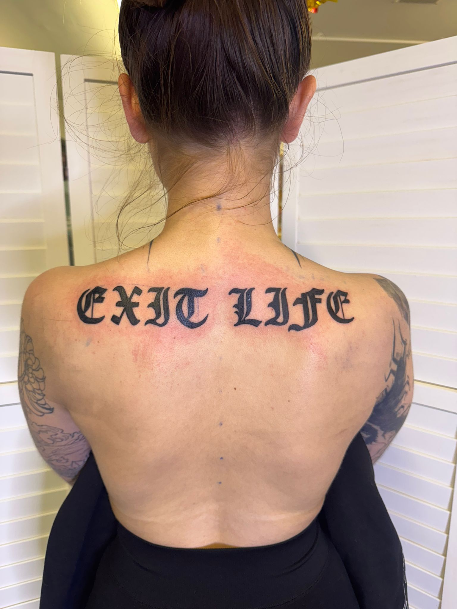 Old English lettering back tattoo by Lost Soul Tattoo